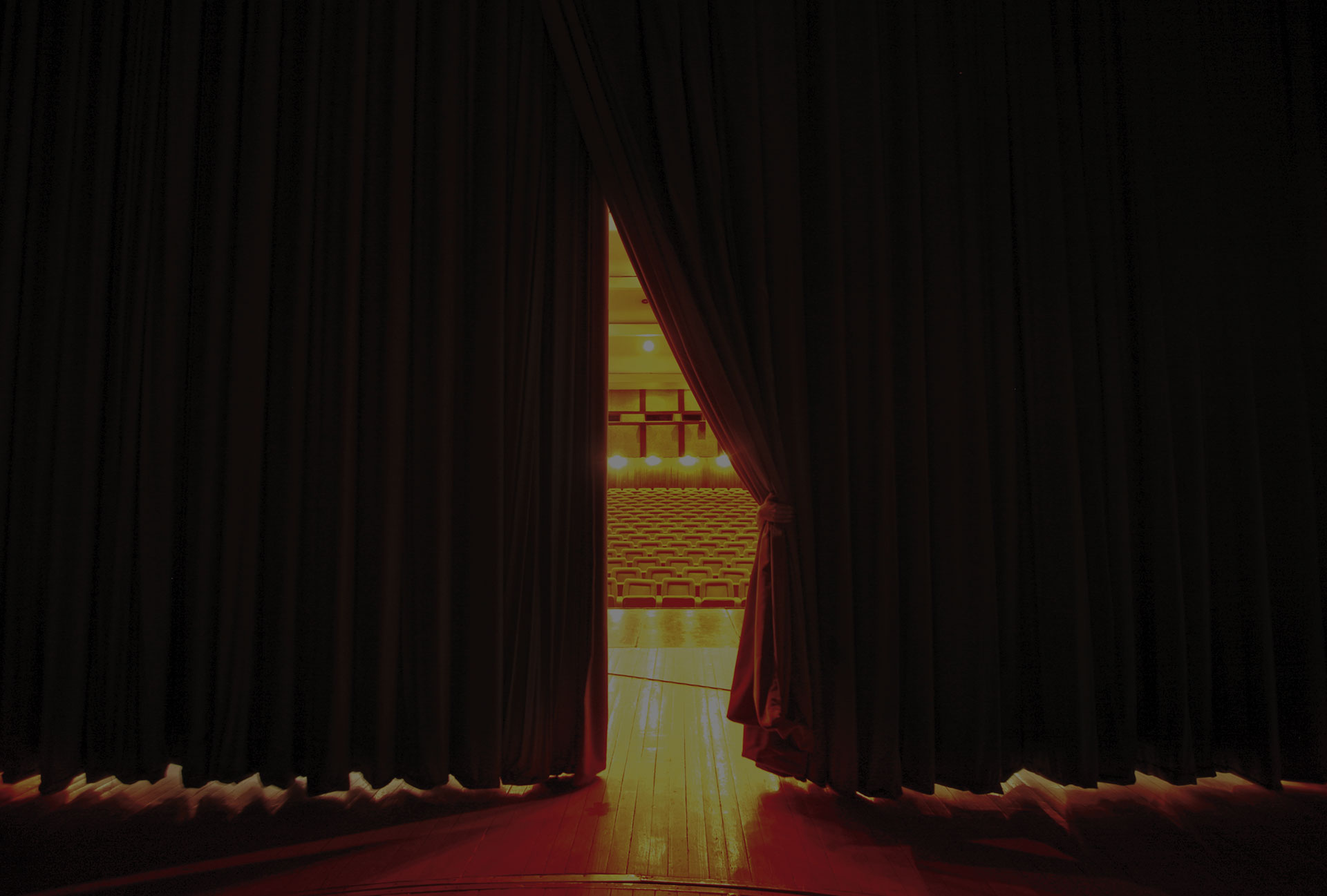 Theater seats through curtains